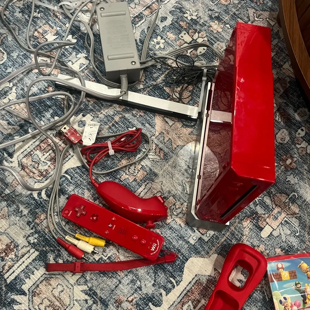 Nintendo Wii in Vibrant Red with Accessories controller. Some times. Works.
